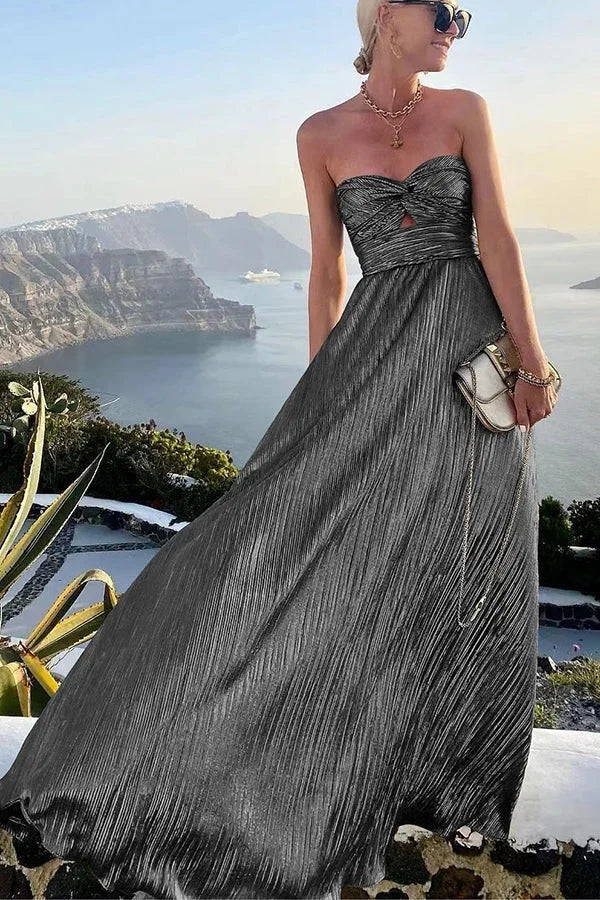 Full-length shot of a glamorous strapless pleated maxi dress, a perfect formal gown for evening events.