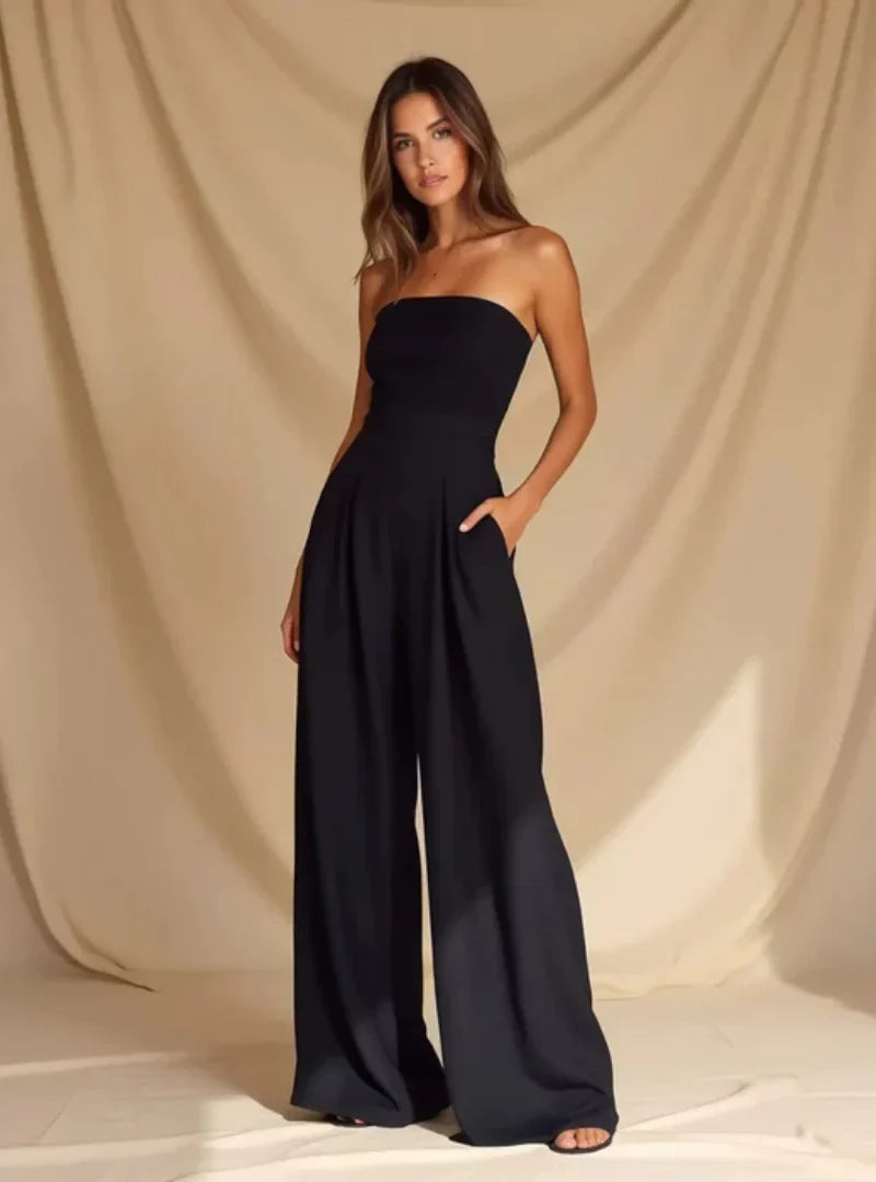 Sophisticated women's strapless wide-leg formal jumpsuit, perfect for a wedding guest or elegant party.