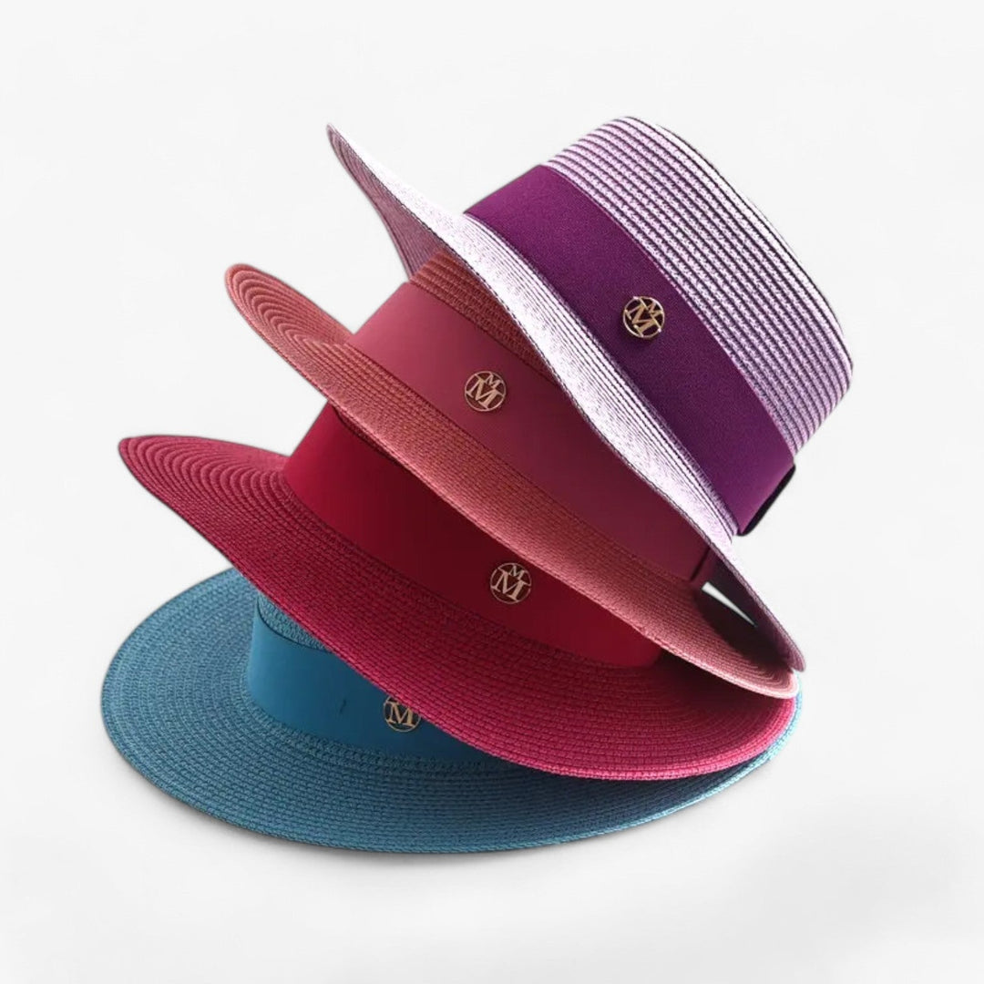 Elegant women's straw sun hat with wide brim, perfect for stylish UV protection during summer.