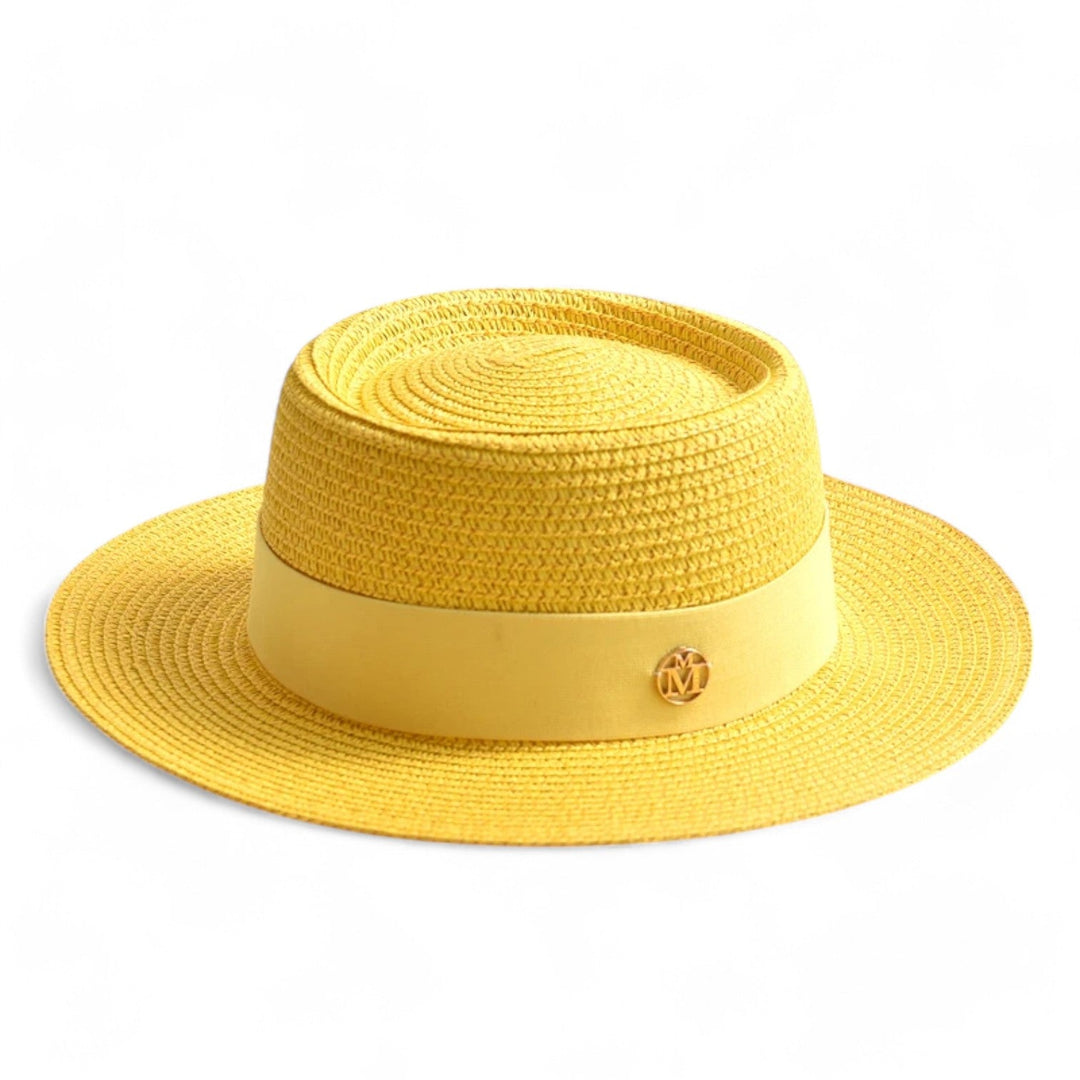 Stylish women's straw hat with UV protection. Elegant wide brim design for sunny summer days.