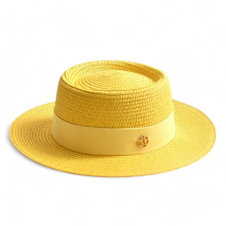 Stylish women's straw hat with UV protection. Elegant wide brim design for sunny summer days.