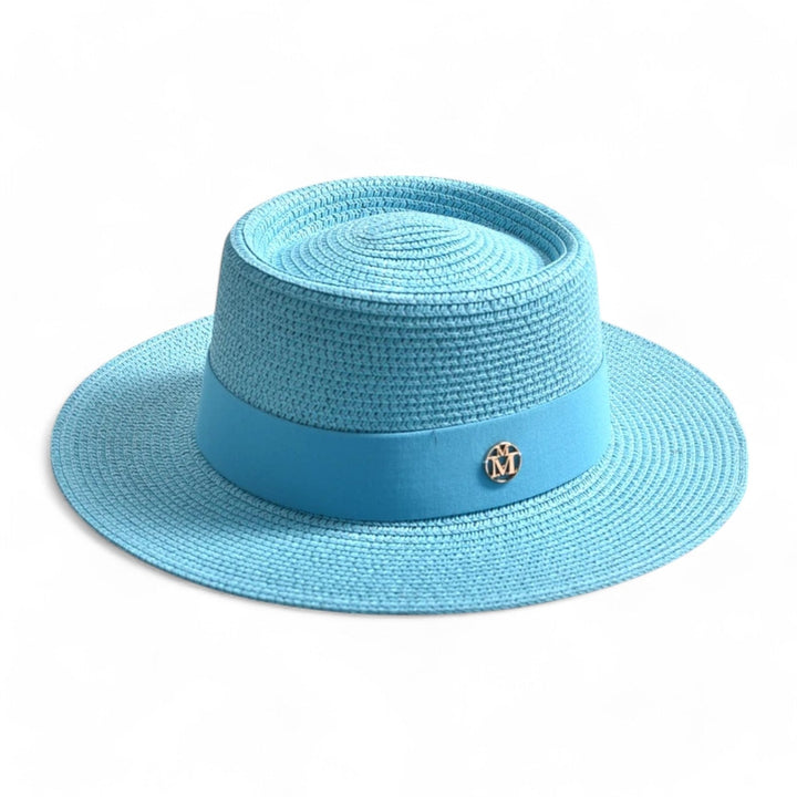 Elegant wide brim straw hat for women. Ideal for beach, travel, and superior UV sun protection.