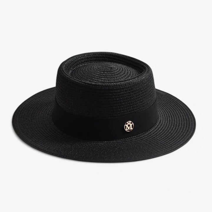 Women's elegant straw beach hat with a wide brim, perfect for summer fashion & UV protection.
