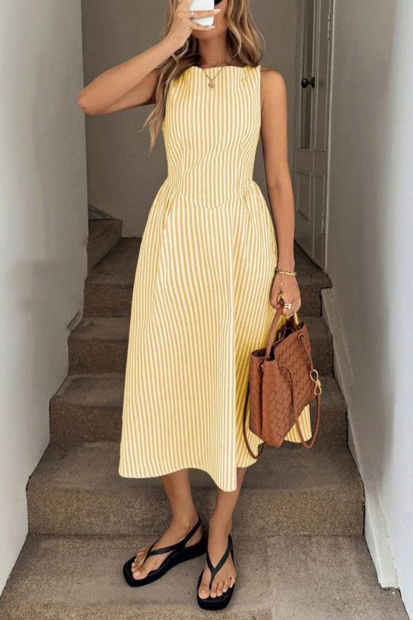 Casual women's midi dress with chic stripes & pleats, featuring a flattering halter neck for vacation style.