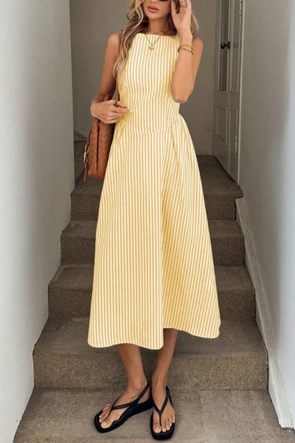 Versatile women's striped halter neck midi dress with elegant pleats, ideal for day-to-night wear.