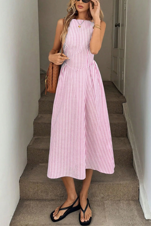 Fashionable women's sleeveless halter neck midi dress, showcasing a striped pattern & elegant pleats.