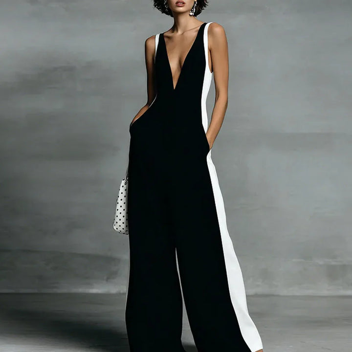Comfortable striped V-neck wide-leg jumpsuit for women, a chic sleeveless one-piece perfect for summer elegance.