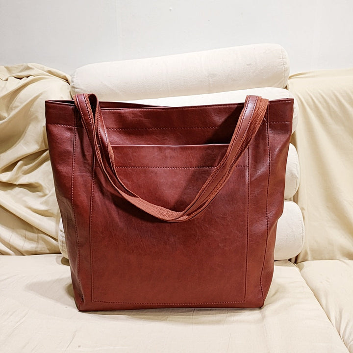 Classic women's structured tote bag for everyday carry. Chic and organized elegant handbag style.