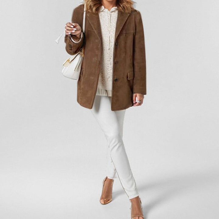 Detailed view of the lapel on an elegant women's suede blazer, showcasing its refined design.