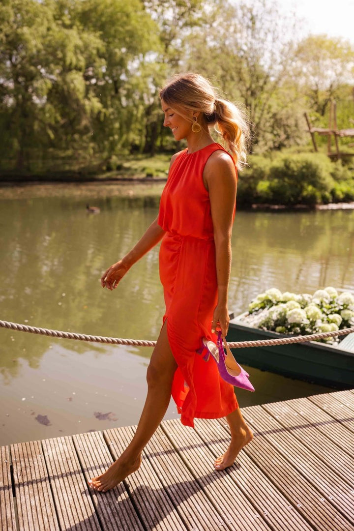 Stylish women's summer midi dress featuring a flowing skirt & adjustable spaghetti straps.