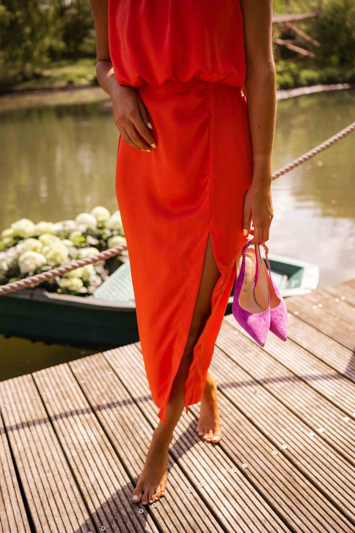 Chic women's summer midi dress with adjustable straps & flowing skirt, offering comfort & style.