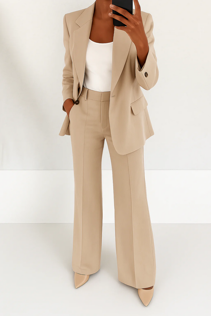 Modern sophisticated women's two-piece suit with tailored blazer & wide leg pants for a chic look.