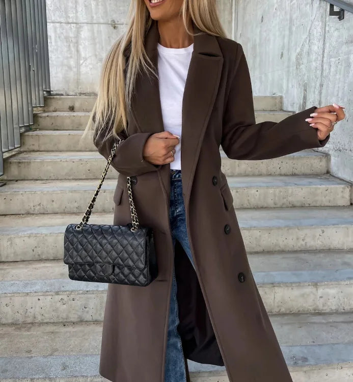 Professional women's long belted coat, a tailored and elegant outerwear piece for office and sophisticated looks.