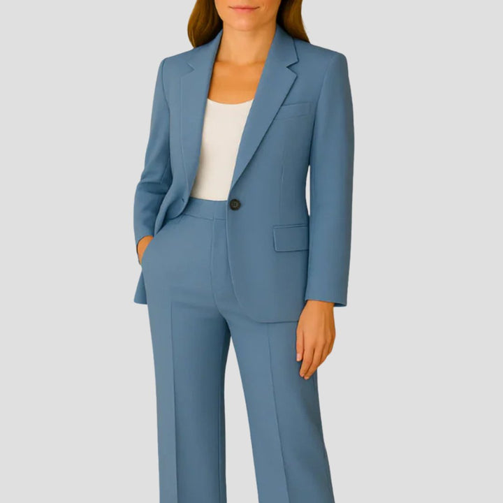 Elegant women's tailored two-piece set: a long sleeve blazer and sophisticated wide leg pants. Formal business attire.