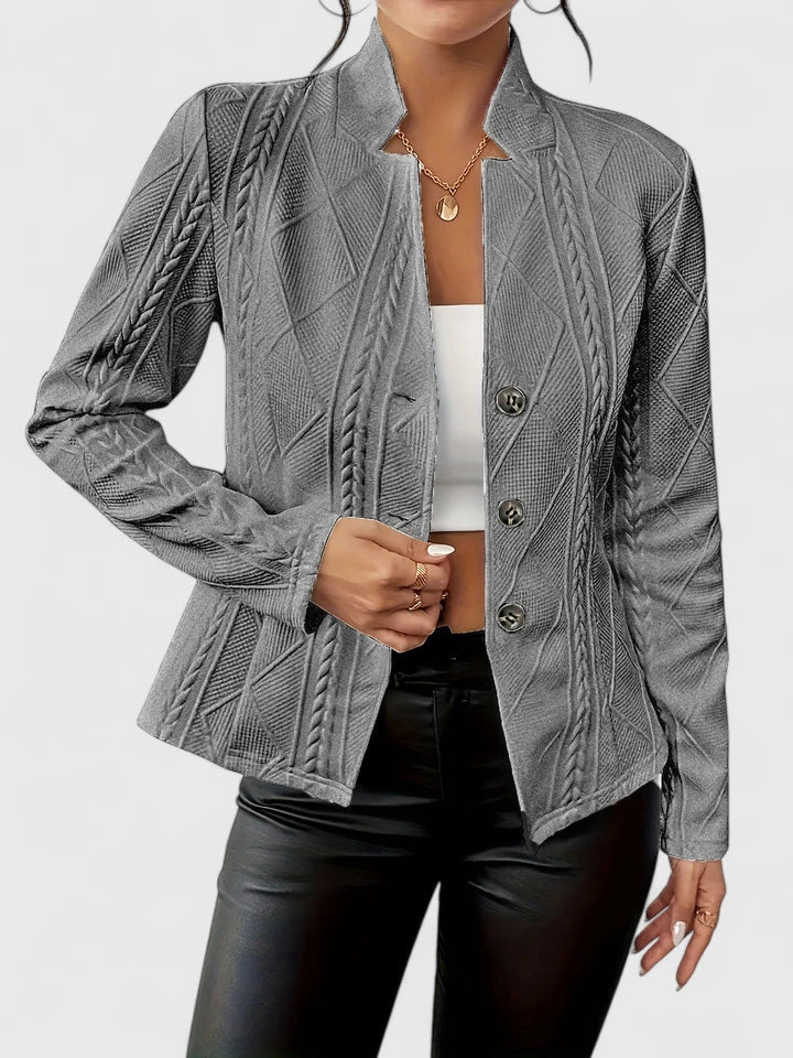 Fashionable women's outerwear jacket: textured, stand-collar, single-breasted design for elegance.