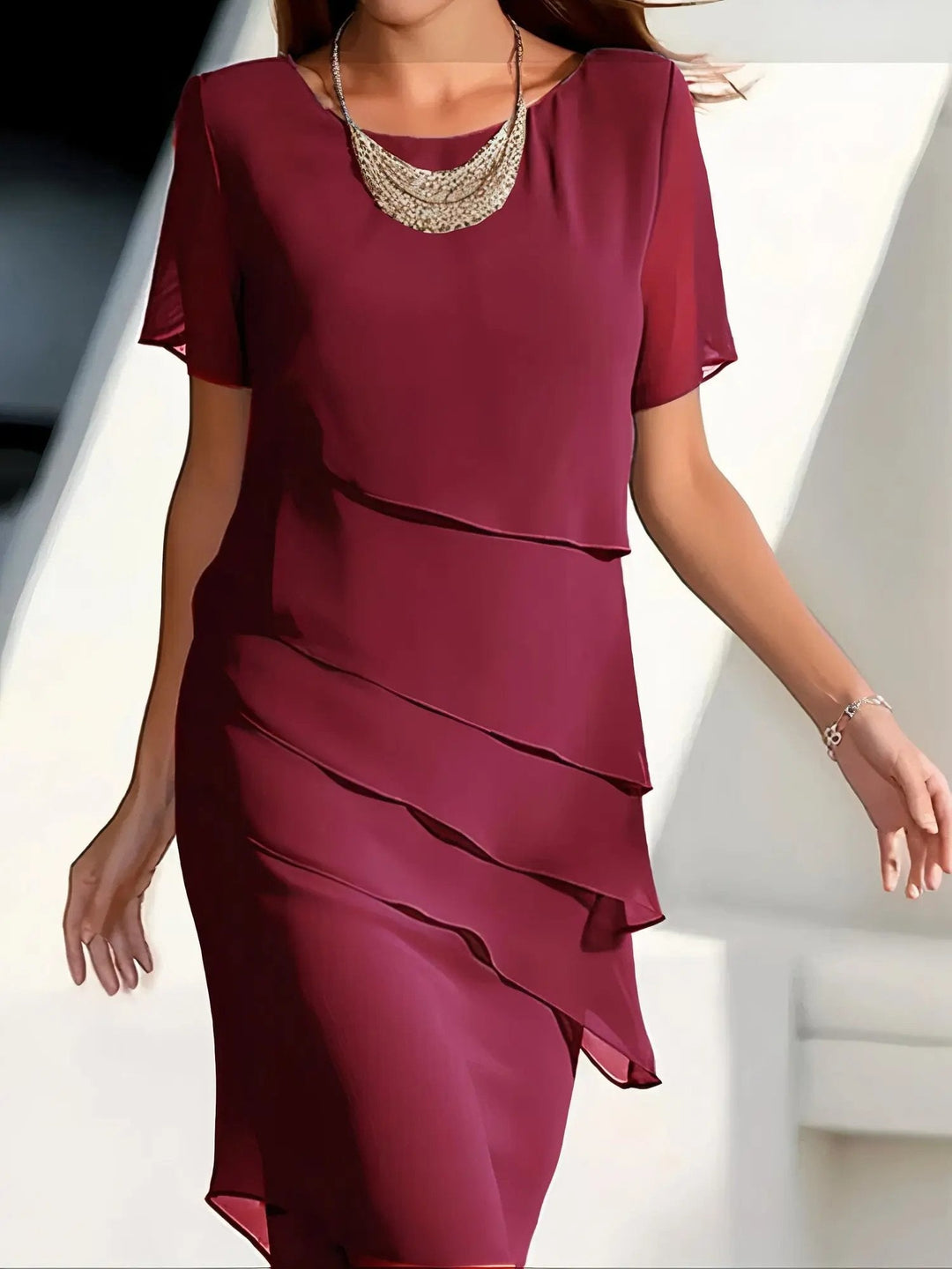 Elegant women's tiered midi dress with flowing fabric. Perfect for parties, special occasions, or chic casual wear.