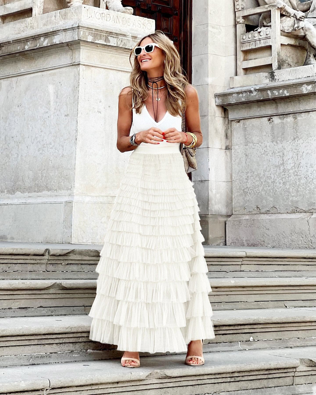 Graceful women's tiered ruffle maxi skirt, flowy and voluminous, ideal for elegant evening and special occasion wear.