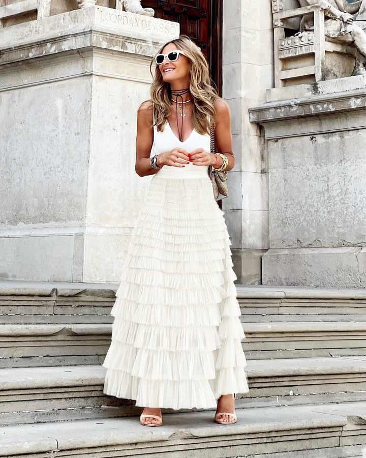 Graceful women's tiered ruffle maxi skirt, flowy and voluminous, ideal for elegant evening and special occasion wear.