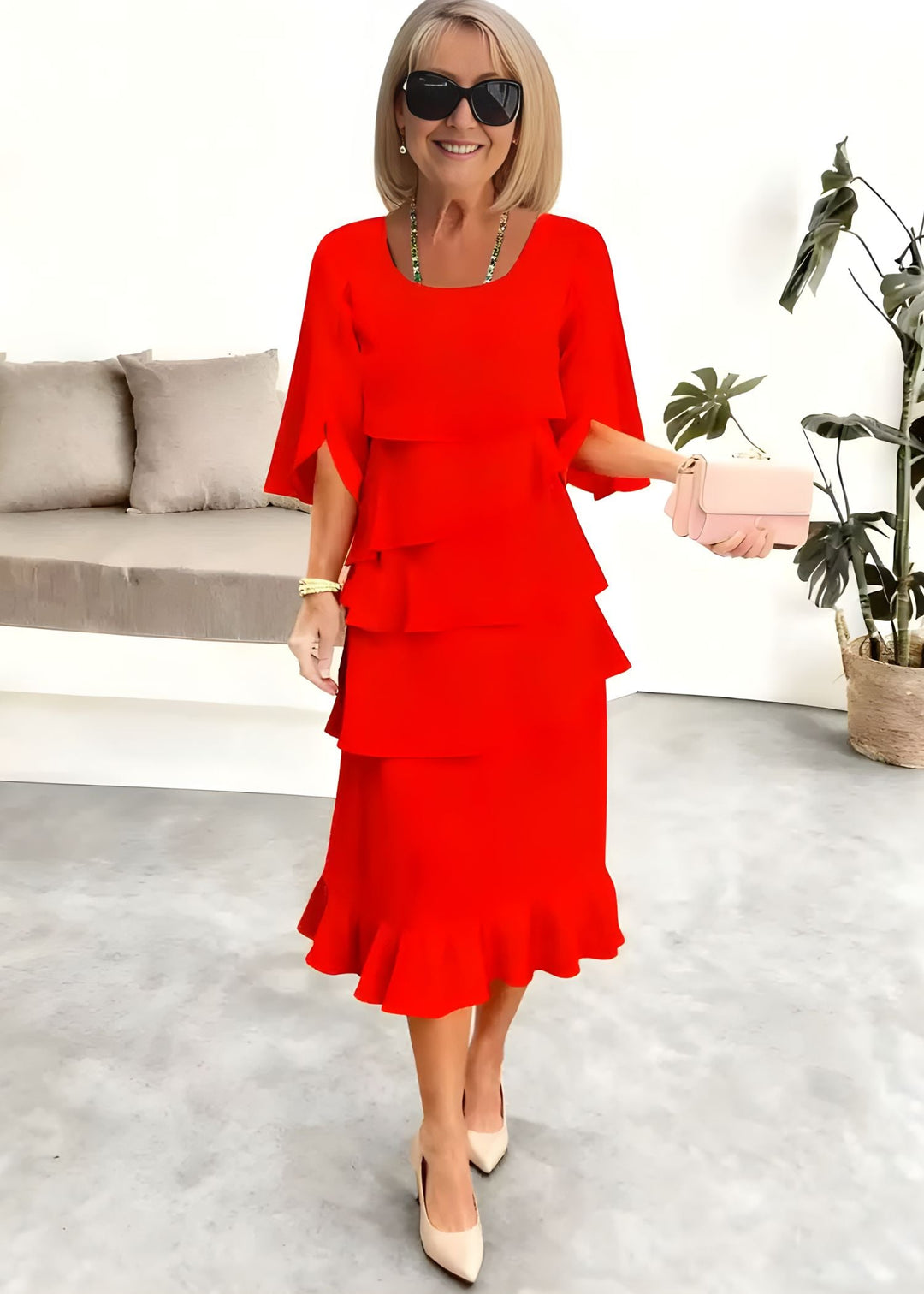 Chic women's tiered midi dress featuring stylish ruffles, round neck, and trendy flared sleeves for summer.