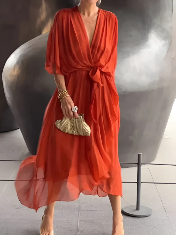 Woman walking in a versatile women's timeless wrap midi dress, showing its elegant and comfortable flow.