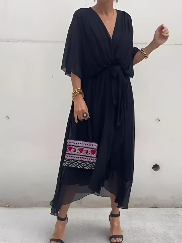 Detail of the flattering tie-waist on an elegant women's timeless wrap midi dress, enhancing comfort & style.