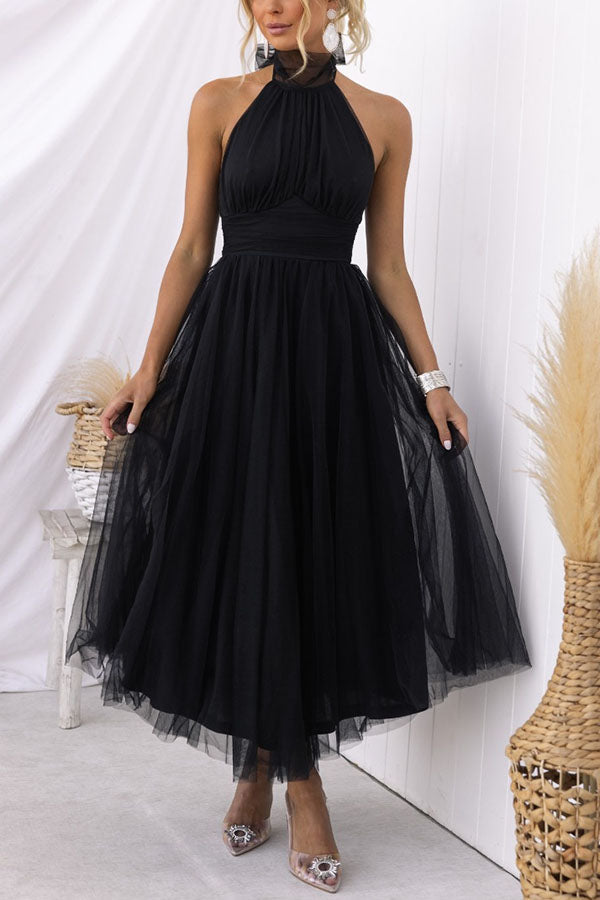 Angled view of elegant women's tulle midi dress, stylish choice for wedding guest & evening wear.