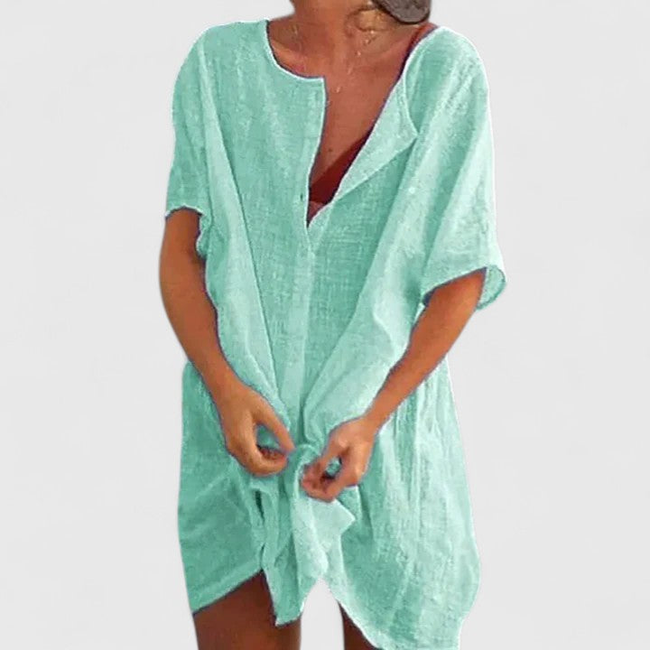 Comfy women's summer dress. Elegant tunic style, perfect for warm weather fashion. Versatile and chic.