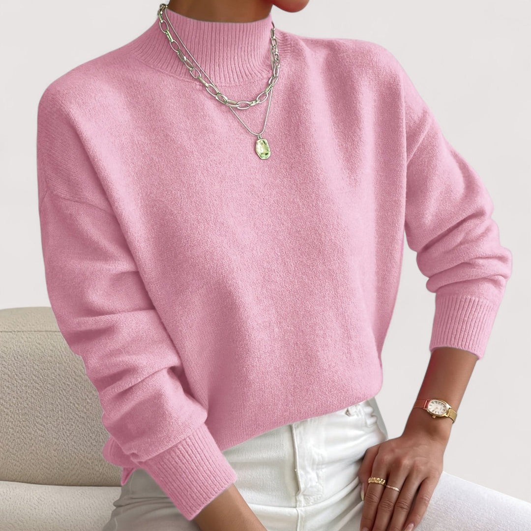 Cozy women's long sleeve turtleneck sweater. Versatile knitwear for elegant fall outfits & winter chic.