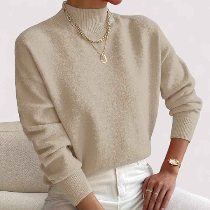 Chic women's turtleneck sweater. Soft & cozy knitwear, perfect for versatile fall and winter styles.