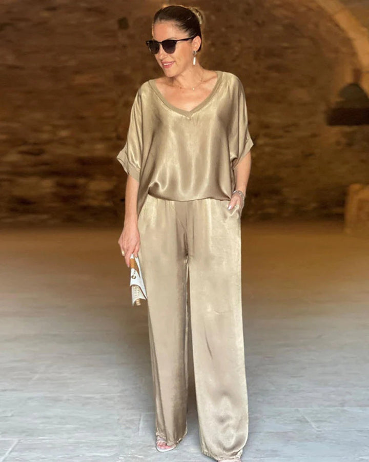 Sophisticated women's matching two-piece top & pants set in a tailored fit for elegant and casual chic style.