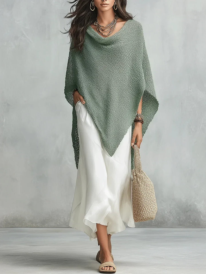 Stylish women's batwing poncho top paired with a sleeveless maxi dress. This elegant two-piece set is perfect for summer.