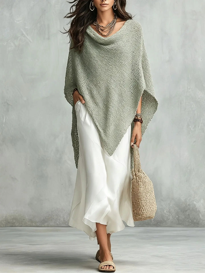 Fashionable women's elegant two-piece poncho maxi dress set. Features a flowy batwing top & comfortable sleeveless dress.