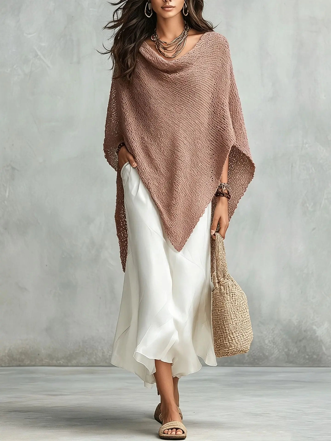 Women's elegant two-piece set: a flowing poncho top and a long sleeveless maxi dress. Perfect casual or dressy attire.