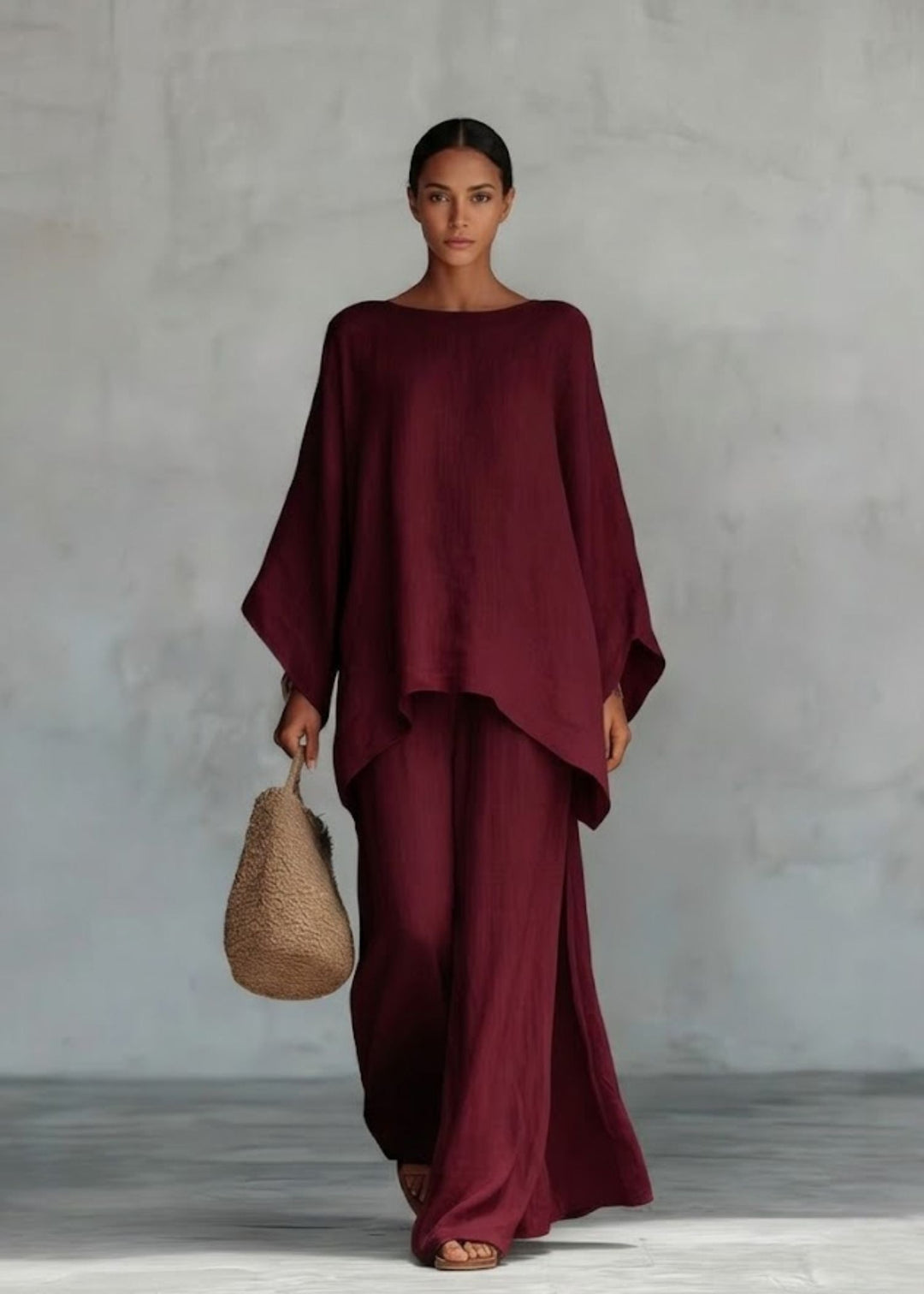 Versatile women's two-piece set, combining a chic cape top and wide-leg pants, perfect for resort or casual wear.