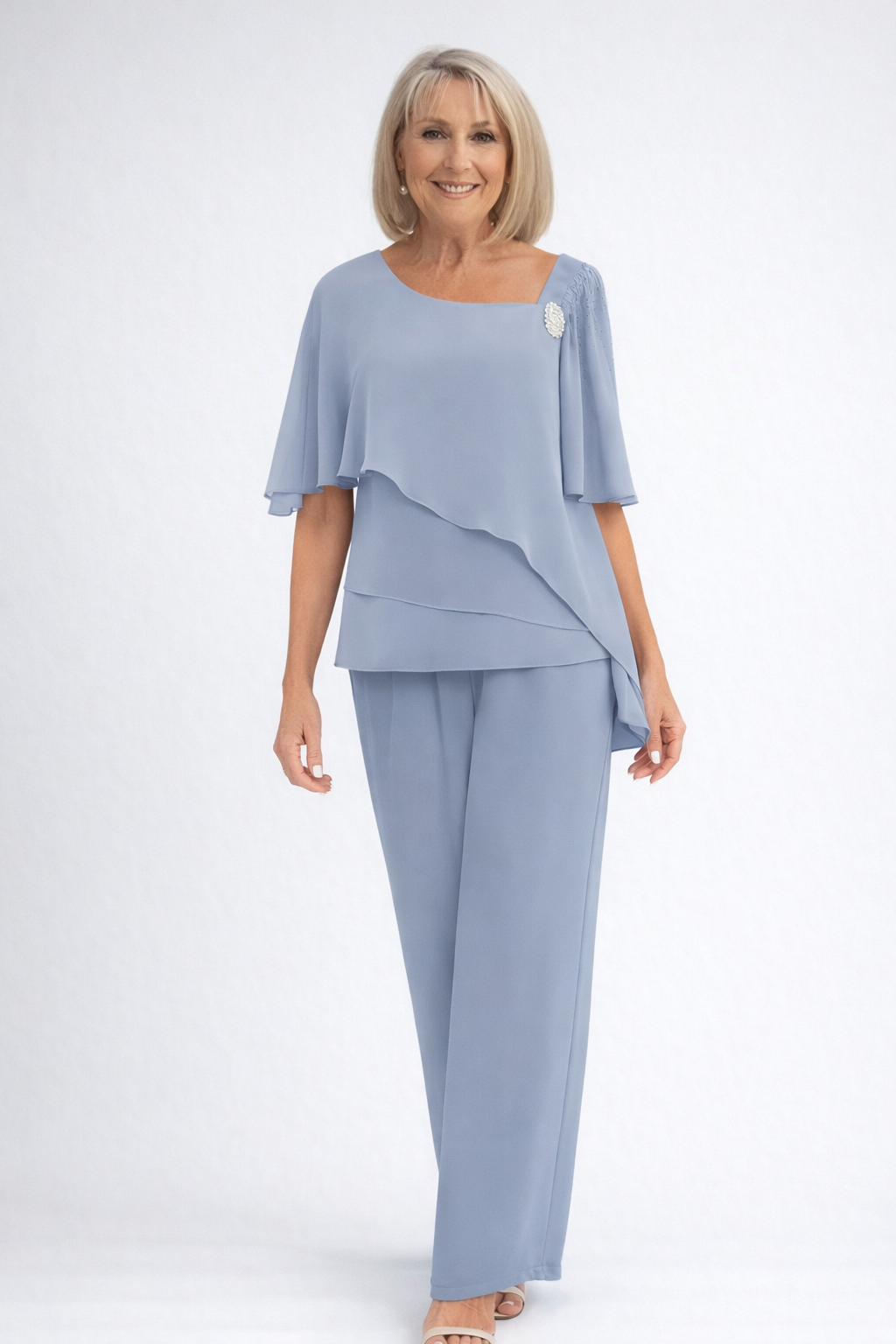 Elegant women's two-piece set featuring a sophisticated cape top & matching trousers, perfect for formal occasions.