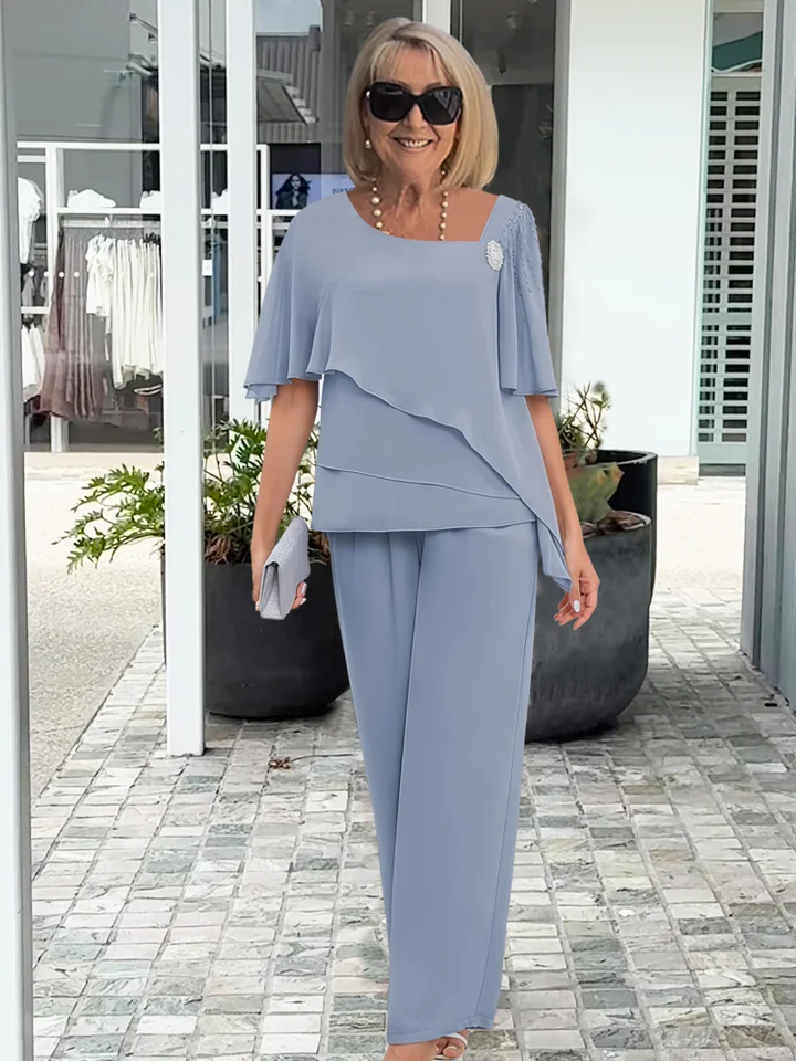 Light blue elegant women's cape top & trouser set, a stylish choice for wedding guests & sophisticated parties.
