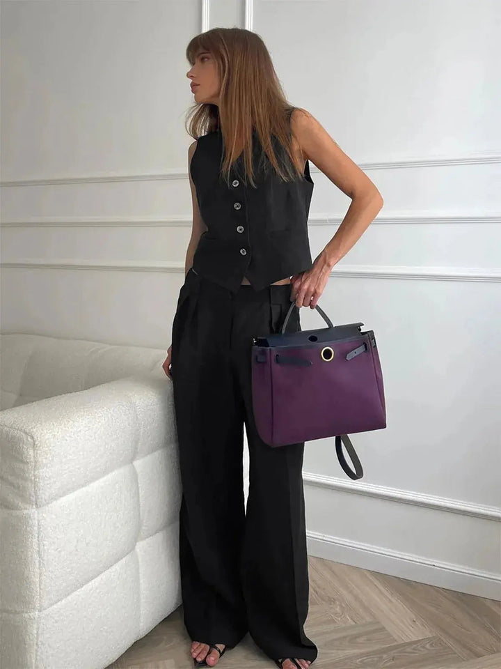 Sophisticated women's two-piece waistcoat and wide-leg trousers set, an elegant choice for spring fashion.