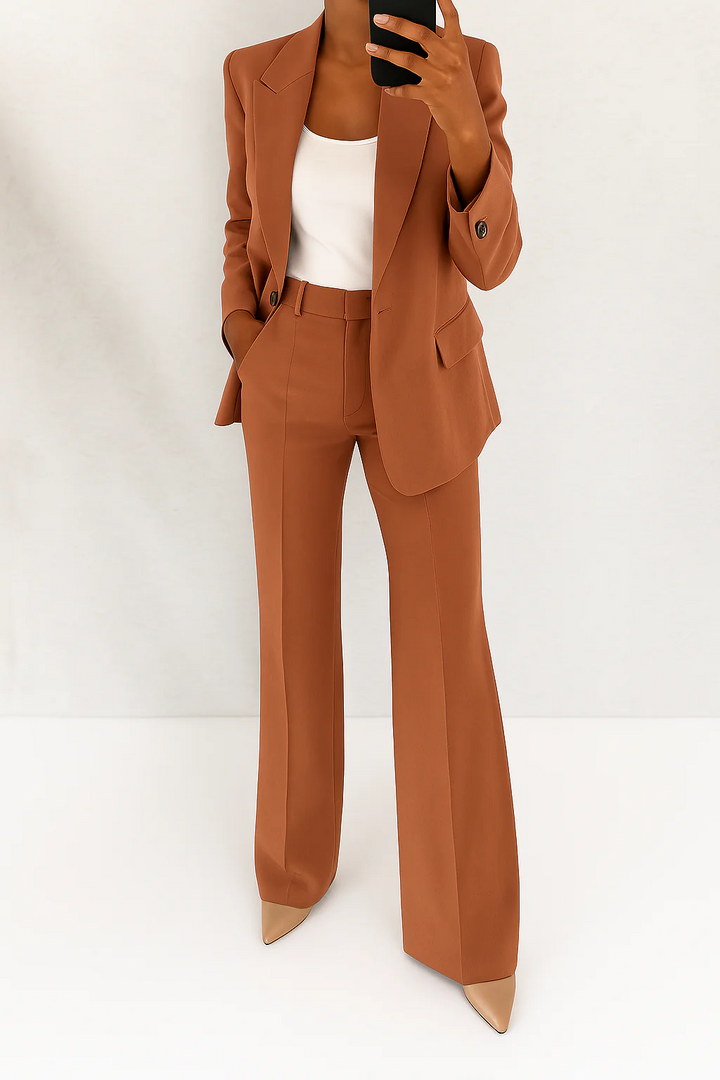 Elegant women's two-piece blazer and trousers suit set, versatile for business casual or formal events.