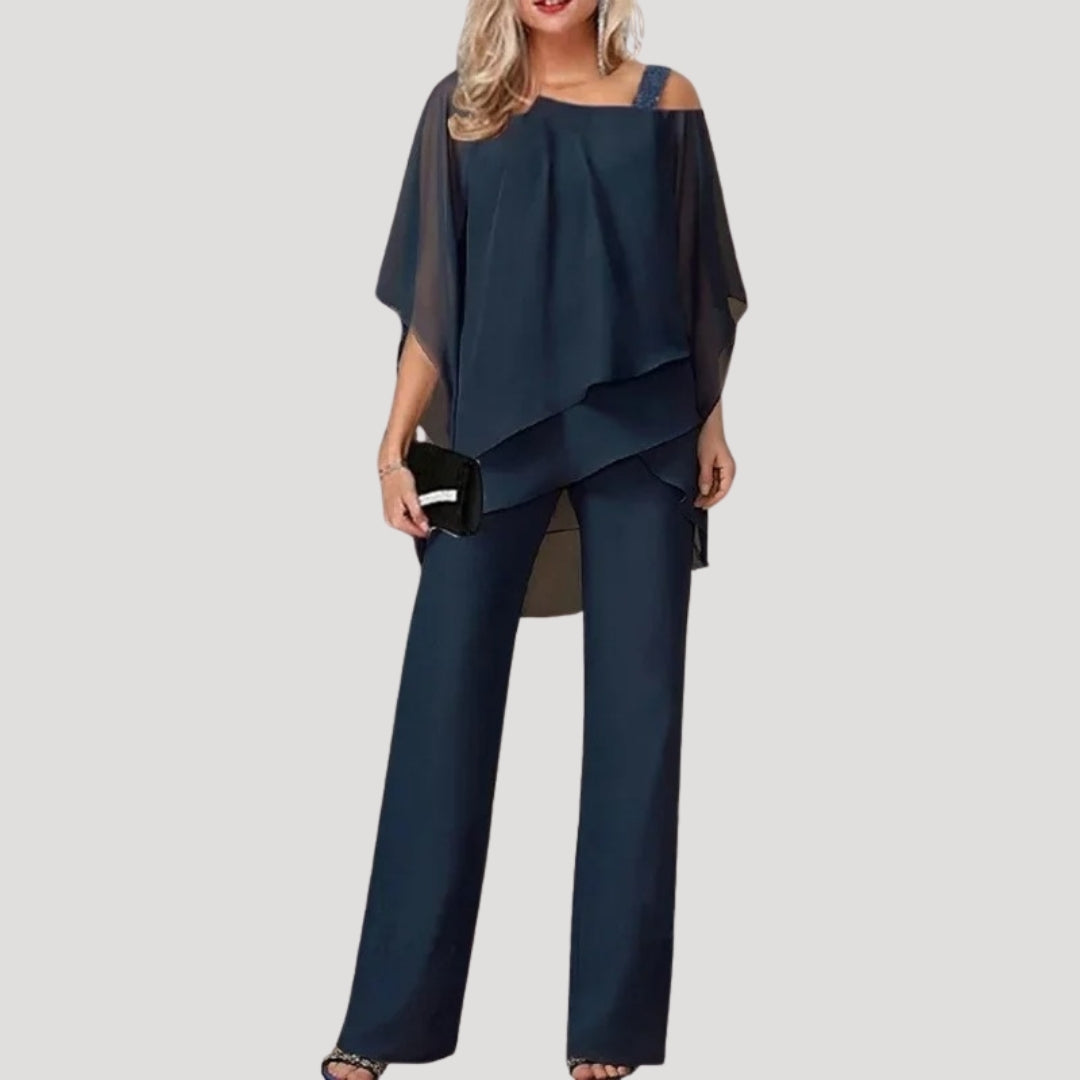 Stylish women's elegant two-piece trouser suit with an asymmetric top & comfortable wide-leg pants for events.