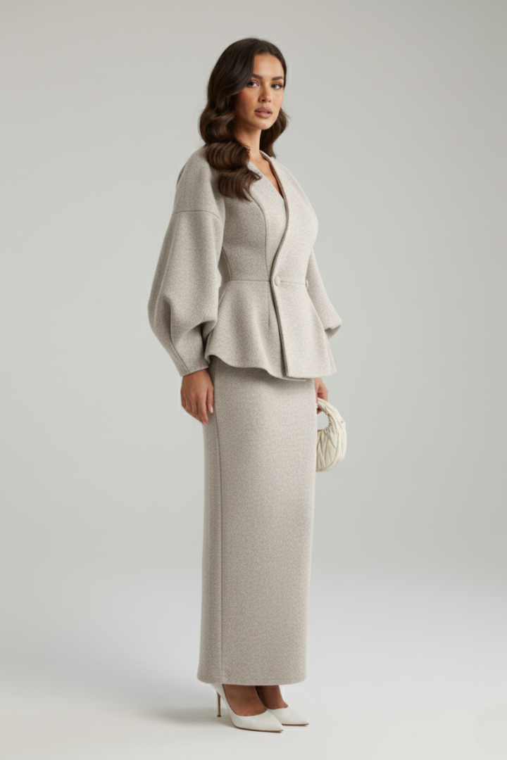Sophisticated women's two-piece skirt suit with V-neck blazer. Elegant formal & office attire for businesswomen.
