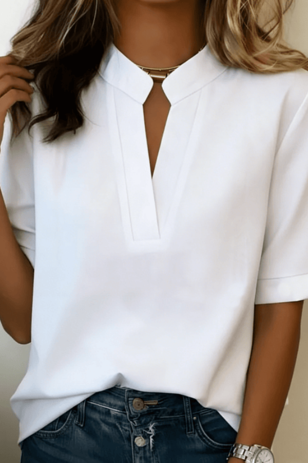 Soft V-neck women's top with a flowing design, offering comfort and timeless elegance for any occasion.