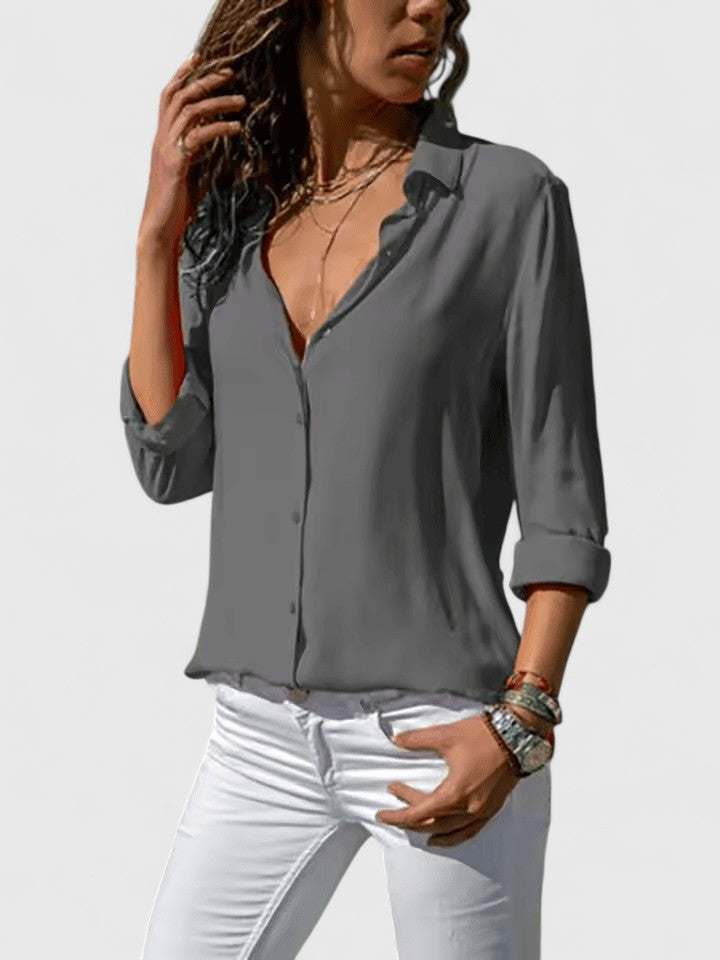 Stylish women's V-neck top with long sleeves, a perfect elegant blouse for office or fashion wear.
