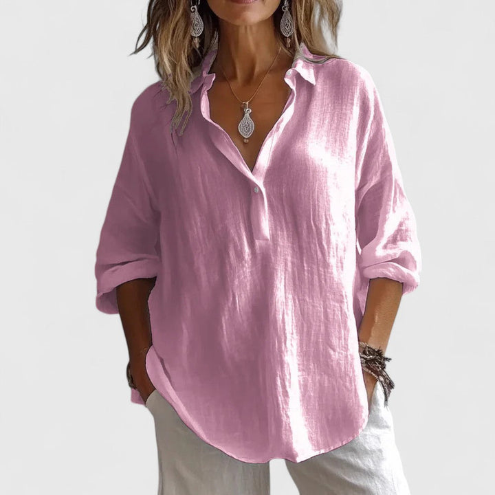 Elegant women's V-neck blouse, versatile for office or casual wear. Stylish and sophisticated spring fashion top.