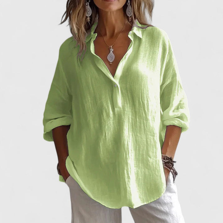 Stylish women's V-neck blouse, perfect for spring/summer. Versatile elegant top with a relaxed fit for any occasion.