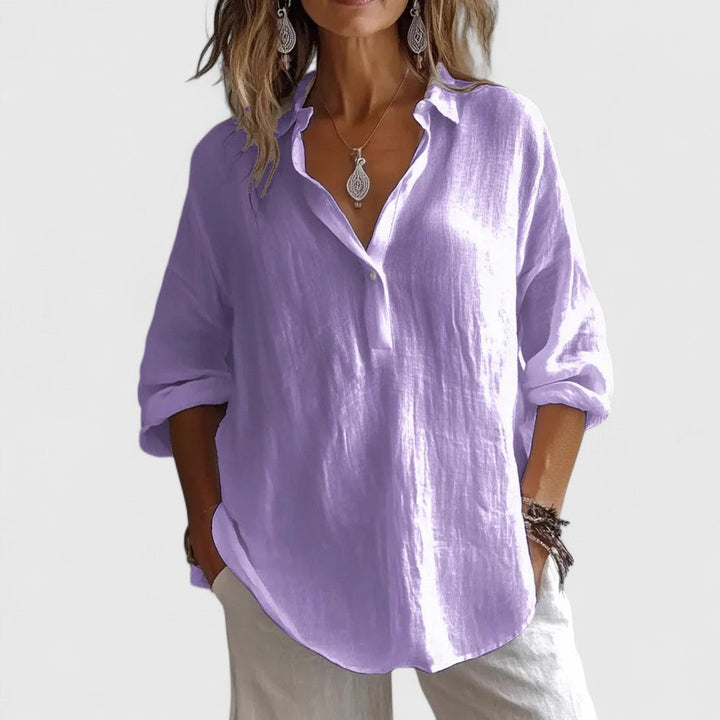 Women's V-neck elegant blouse, relaxed fit, perfect for versatile spring fashion. Sophisticated and stylish womenswear.