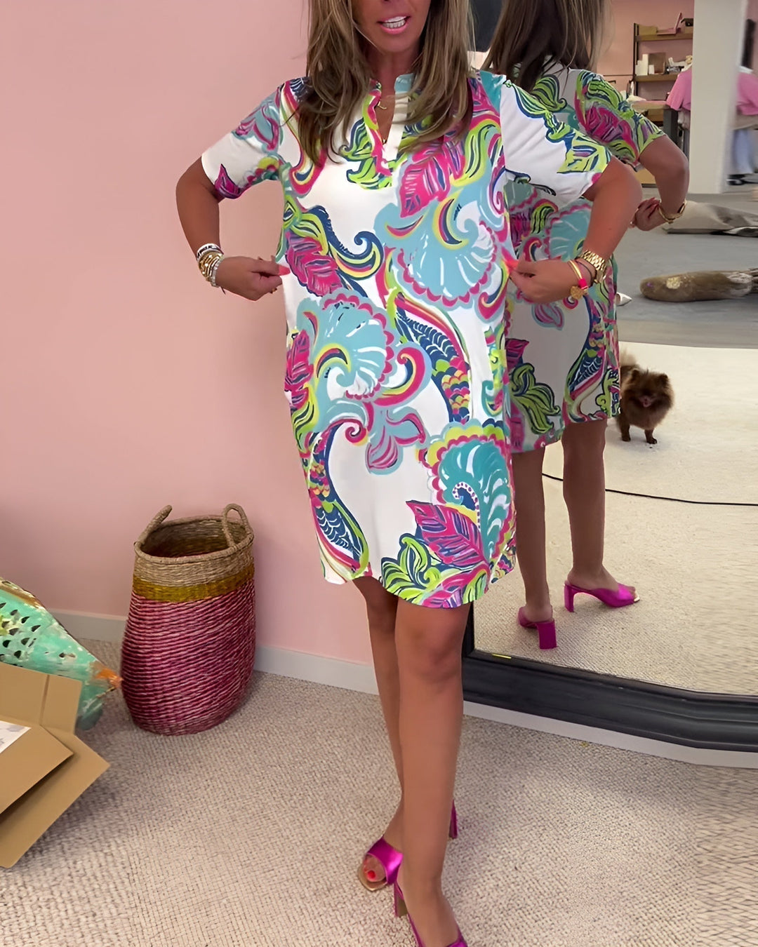 Elegant women's V-neck draped midi dress with a beautiful print. A chic and flattering summer style.