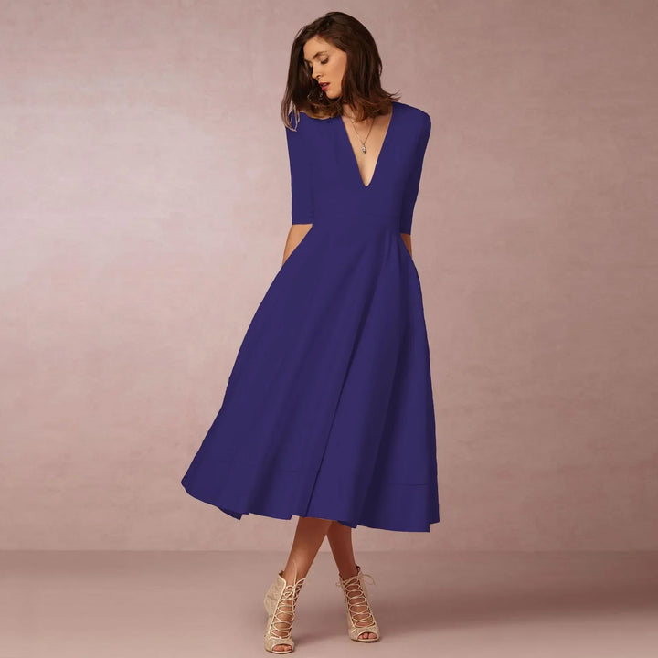 Chic purple V-neck midi dress for women, featuring elbow sleeves. Versatile, comfortable & timeless fashion.