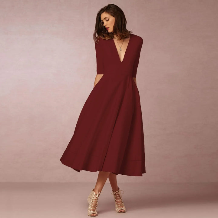 Comfortable women's V-neck midi dress with elbow sleeves, ideal for versatile casual to formal occasions.