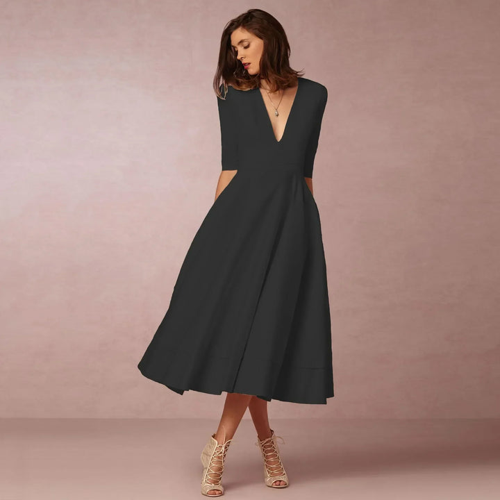 Timeless style: women's elegant V-neck elbow-sleeve midi dress, a versatile fashion essential.