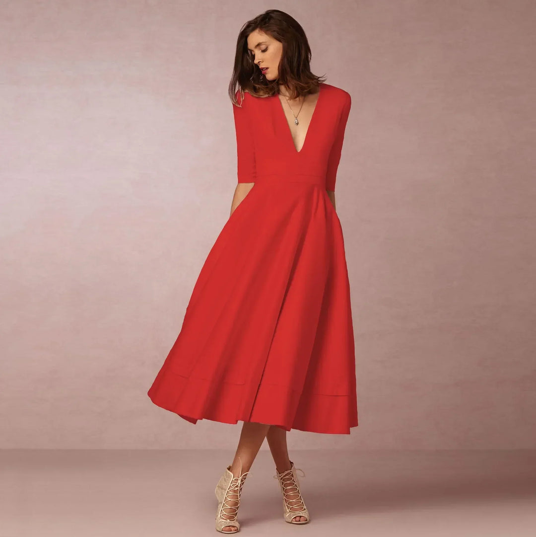 Stylish elbow-sleeve midi dress with a flattering V-neck, embodying versatile women's fashion.